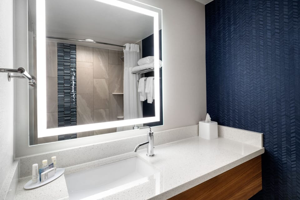 Rainfall showerhead, designer toiletries, hair dryer, towels