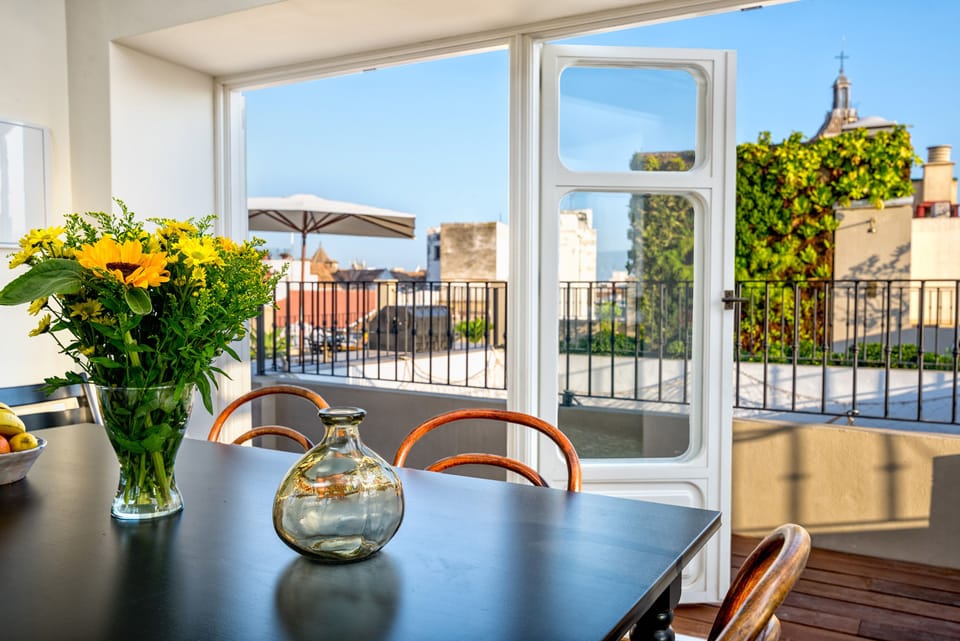 Deluxe Duplex, City View | Living area | 50-inch LCD TV with cable channels