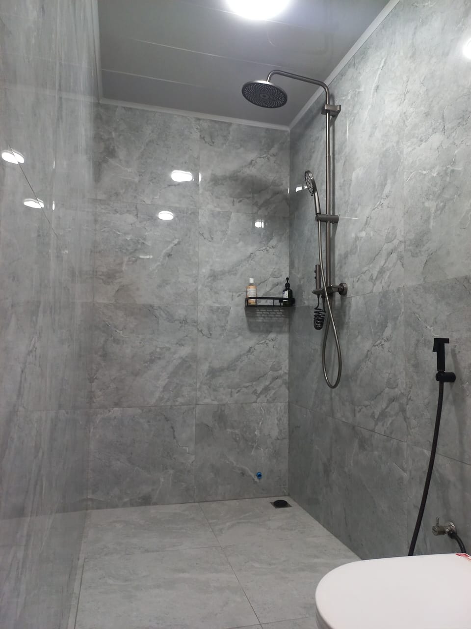 Shower, hair dryer, slippers, towels