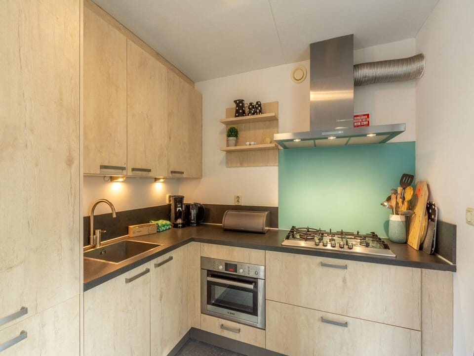 Villa | Private kitchen | Stovetop, electric kettle, toaster, highchair
