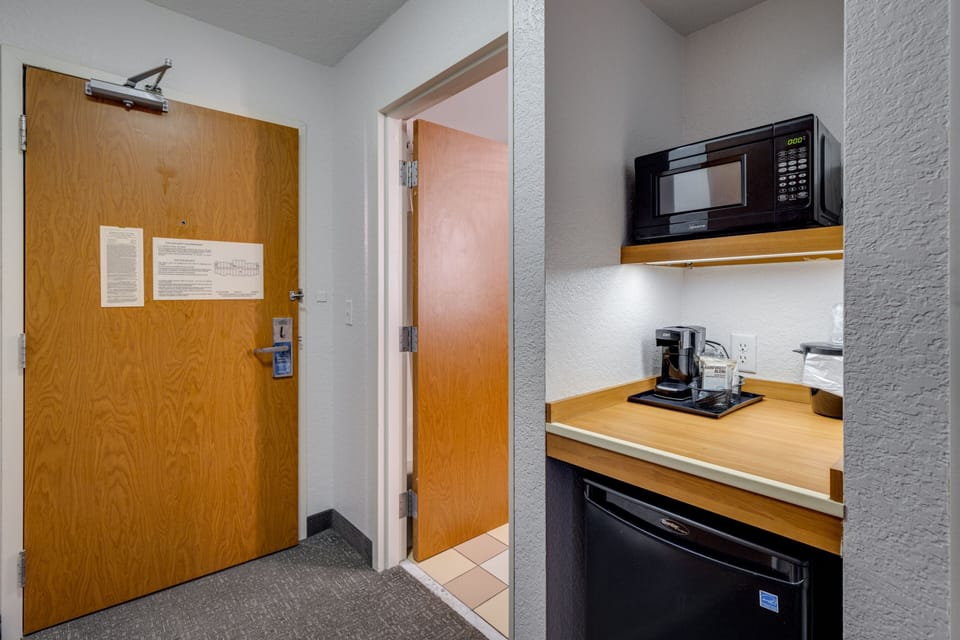 Desk, laptop workspace, blackout drapes, iron/ironing board