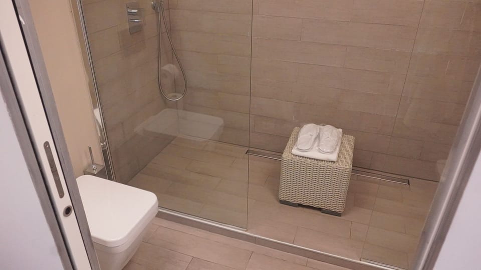 Junior Double Room, Balcony, Sea View | Bathroom | Shower, hair dryer, slippers, towels