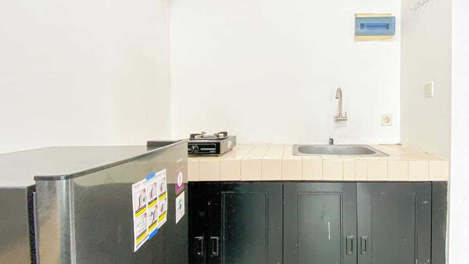Apartment | Private kitchen | Fridge, stovetop, rice cooker, dining tables