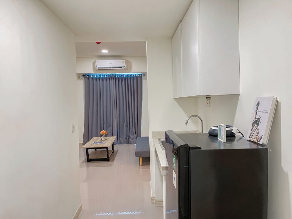 Apartment | Private kitchen | Full-size fridge, stovetop, rice cooker, dining tables