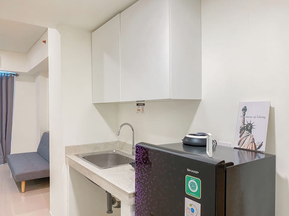 Apartment | Private kitchen | Full-size fridge, stovetop, rice cooker, dining tables