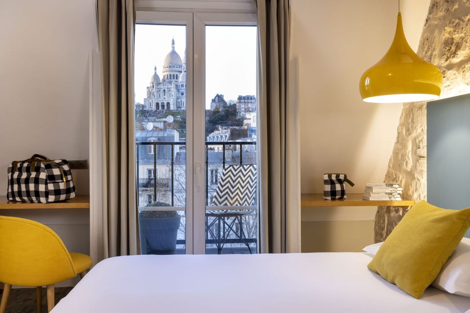Quadruple Room with Balcony and View | Desk, blackout drapes, iron/ironing board, travel crib