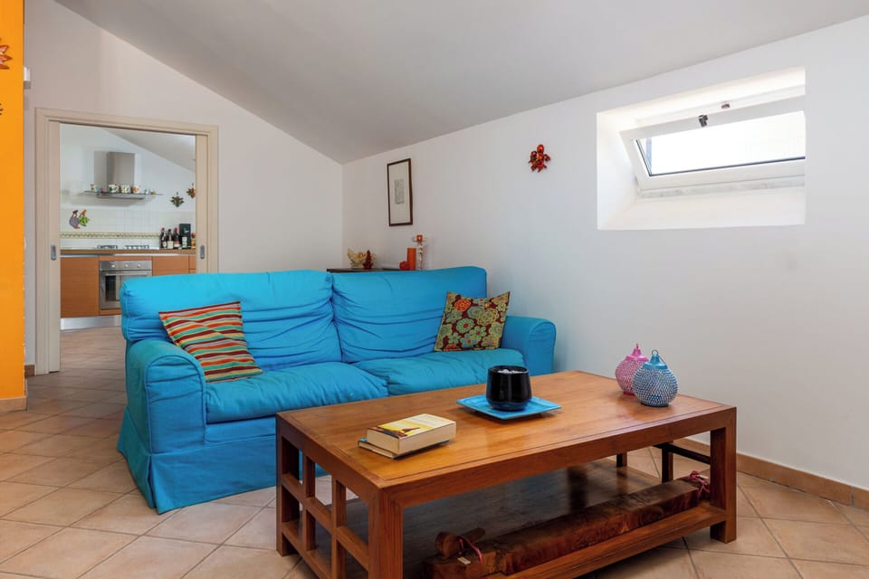Family Apartment | Living area | 40-inch flat-screen TV with digital channels