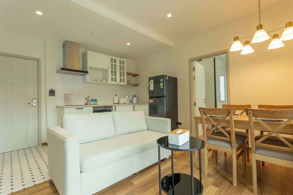 Basic Condo, Pool View | Living area | Flat-screen TV