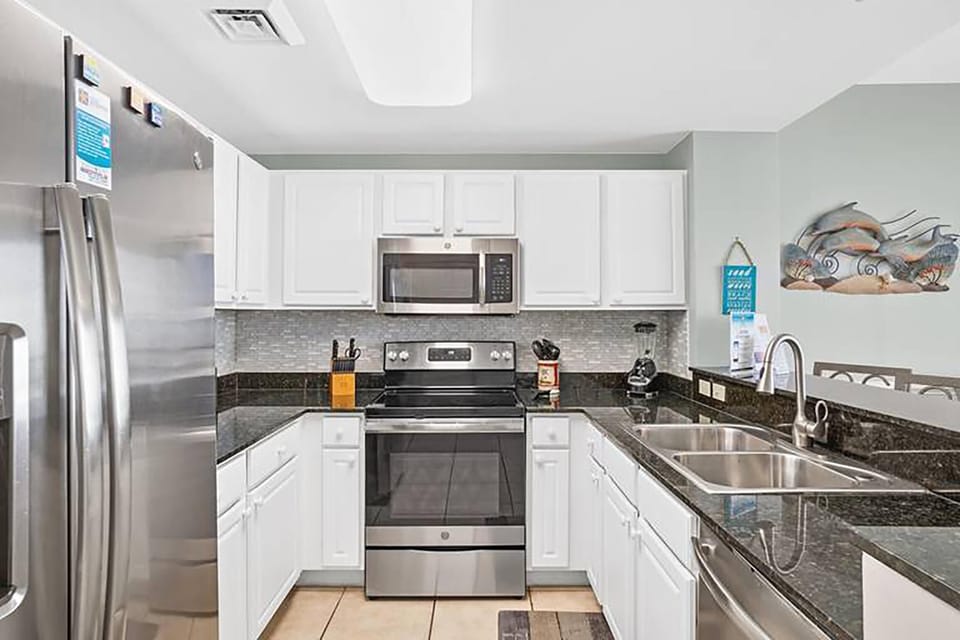 Condo, 1 King Bed with Sofa bed (Calypso 2-103 West - Dolphin View) | Private kitchen | Oven, toaster