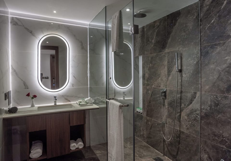 Deluxe Double Room, Balcony, Resort View | Bathroom | Rainfall showerhead, hair dryer, bathrobes, slippers