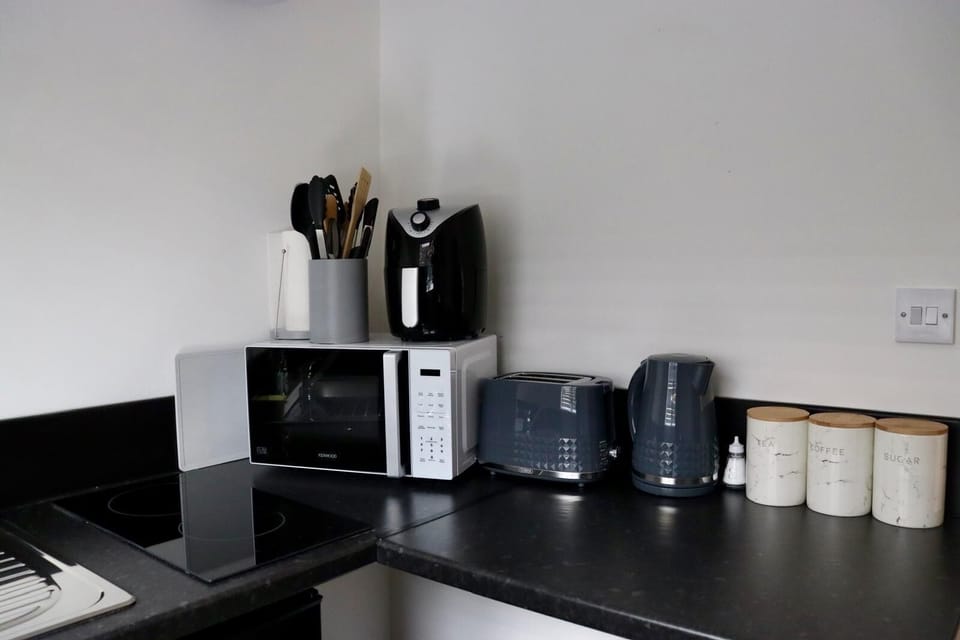 Electric kettle, toaster, cleaning supplies, freezer