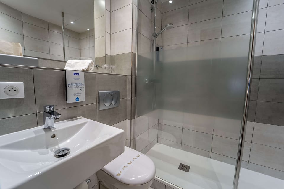 Shower, eco-friendly toiletries, hair dryer, towels