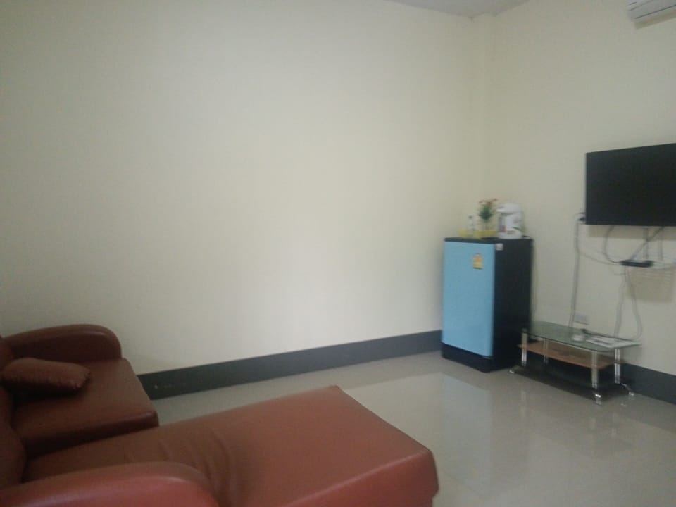Quadruple Room | Living area | 30-inch LCD TV with satellite channels