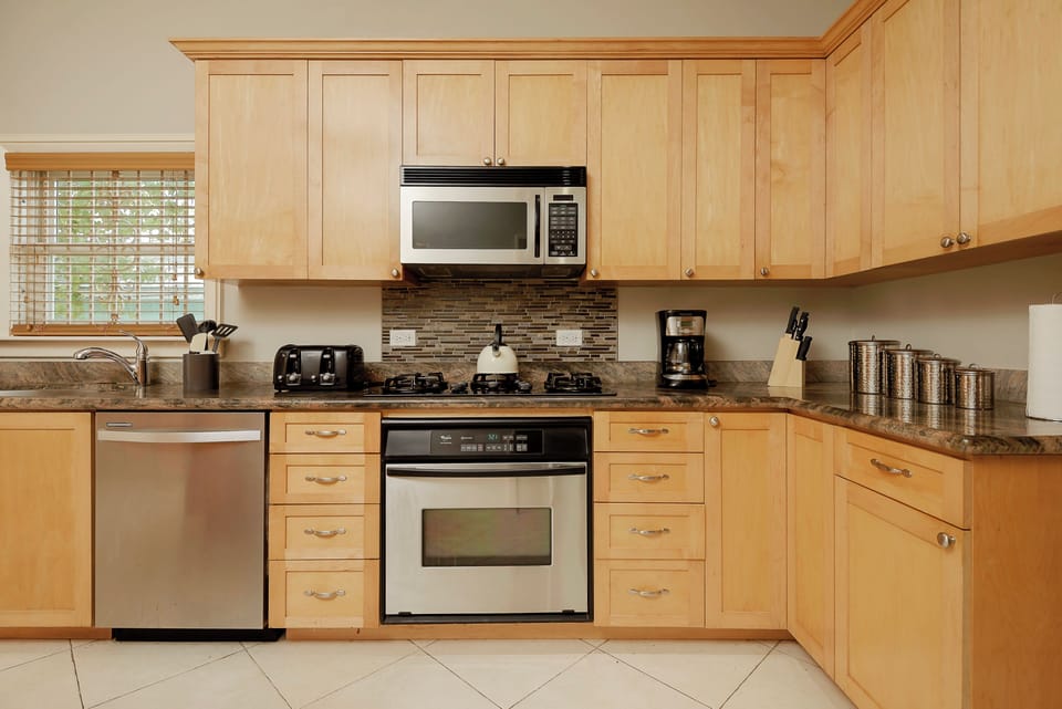 Three-Bedroom Villa | Private kitchen | Full-size fridge, microwave, stovetop, highchair