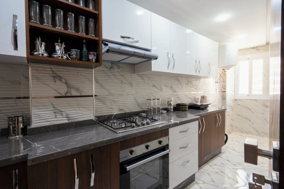 Deluxe Apartment, Balcony, City View | Private kitchen | Full-size fridge, microwave, oven, stovetop