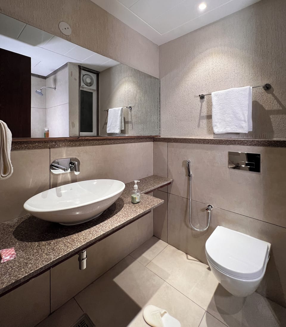 Shower, slippers, towels, soap
