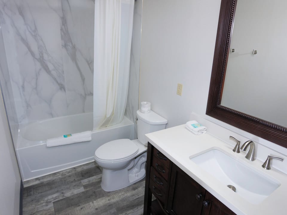 Standard Room, 2 Queen Beds, Non Smoking | Bathroom | Combined shower/tub, free toiletries, hair dryer, towels