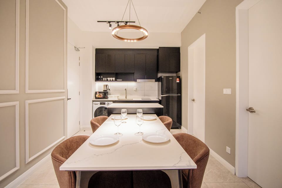 Deluxe Apartment, 3 Bedrooms, City View | Living area | 50-inch LED TV with digital channels