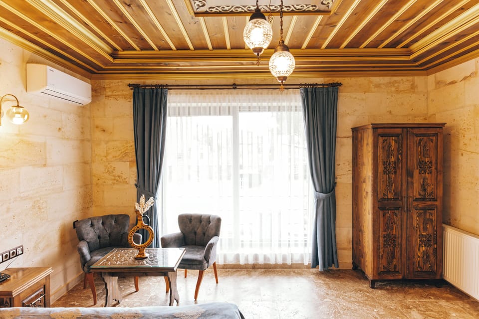 Deluxe Double Room, Balcony | Living area | TV