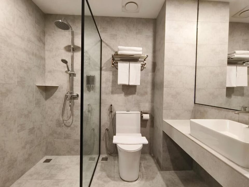Shower, hair dryer, slippers, towels