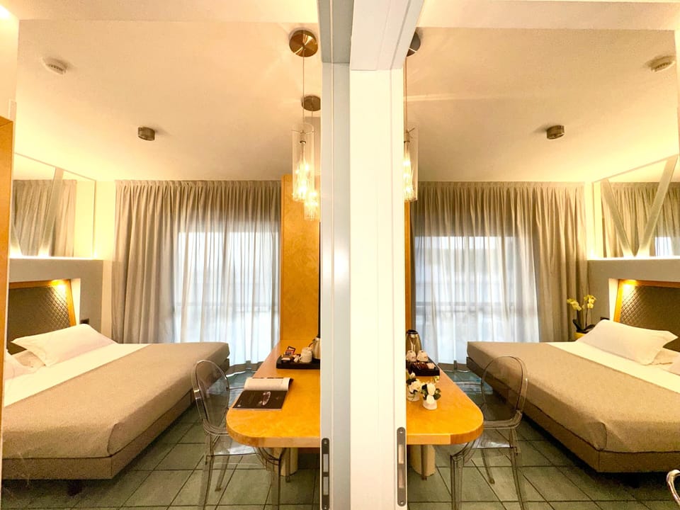 Family Room, 2 Bedrooms, Partial Sea View | Minibar, in-room safe, desk, soundproofing