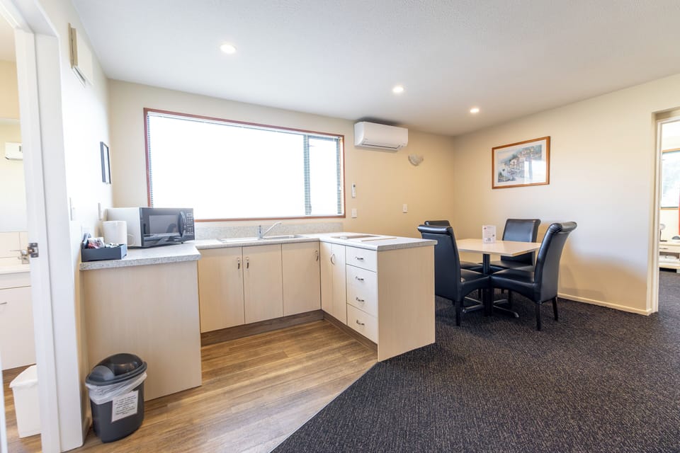 Premium One Bedroom Suite | Private kitchen | Mini-fridge, microwave, stovetop, cookware/dishes/utensils