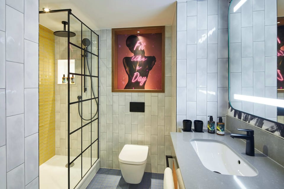 Shower, hair dryer, towels, shampoo