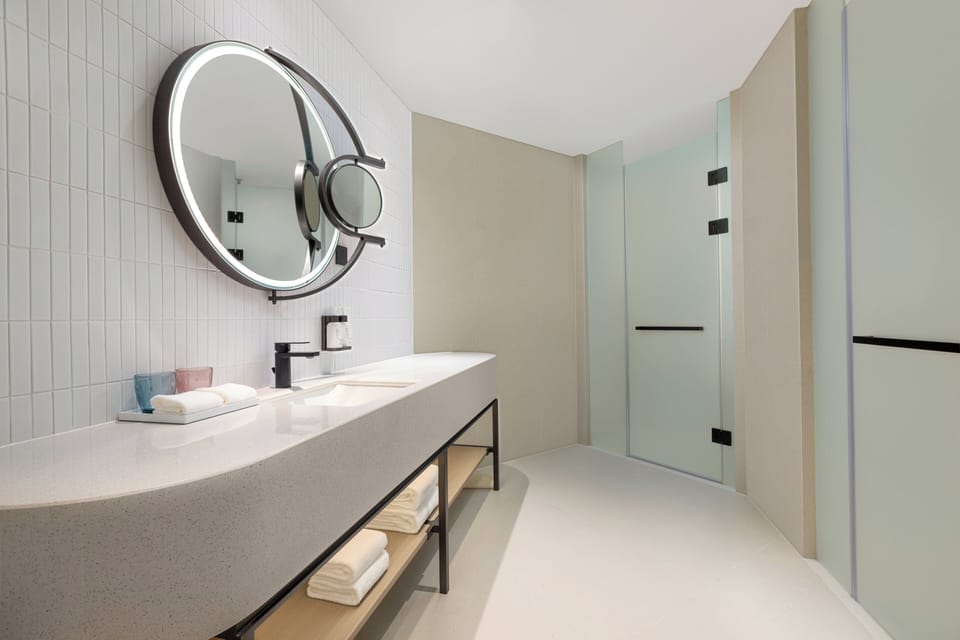 Suite, 1 Bedroom, Garden View | Bathroom | Shower, rainfall showerhead, free toiletries, hair dryer