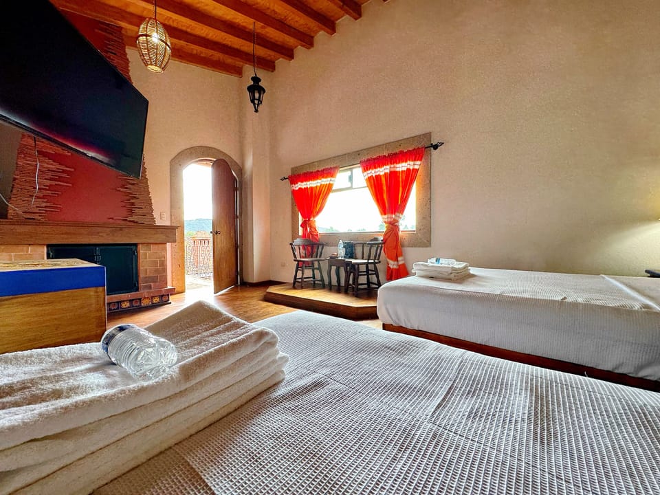 Deluxe Quadruple Room, Garden View | Desk, laptop workspace, iron/ironing board, free WiFi