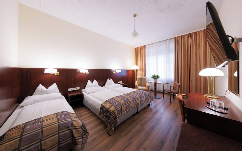 Triple Room, Multiple Beds | In-room safe, desk, iron/ironing board, free cribs/infant beds