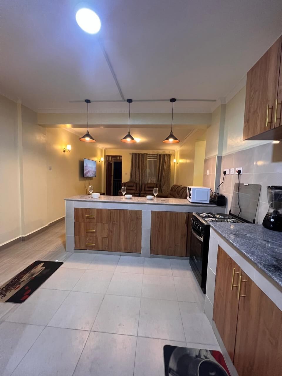 Family Apartment, Balcony, City View | Private kitchen | Fridge, microwave, cookware/dishes/utensils, dining tables