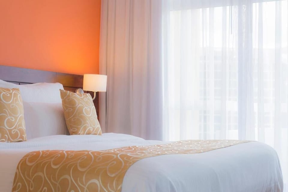 Deluxe Double Room, Balcony, City View | Minibar, in-room safe, desk, laptop workspace