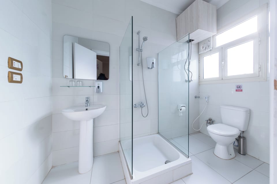 Standard Single Room, Balcony, City View | Bathroom | Shower, towels, soap, shampoo