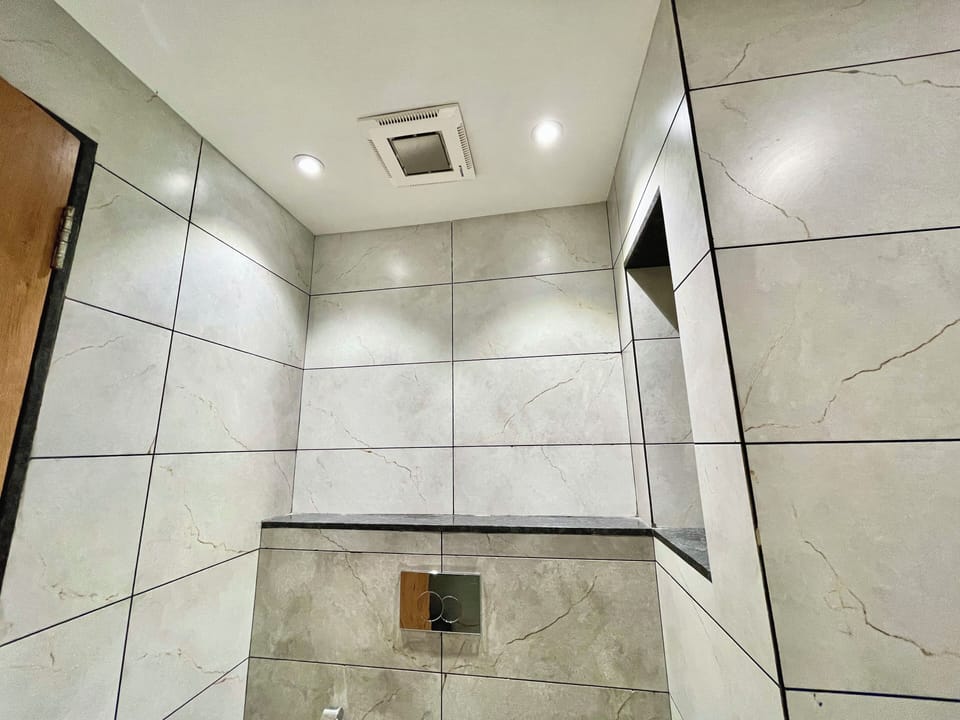Shower, rainfall showerhead, towels, soap