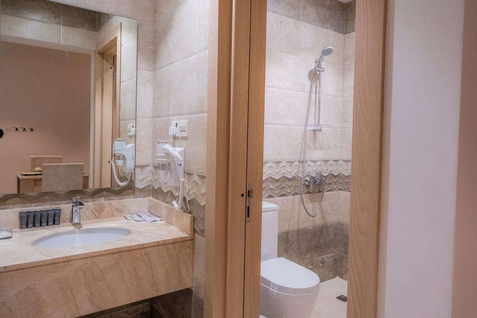 Shower, hair dryer, bathrobes, towels