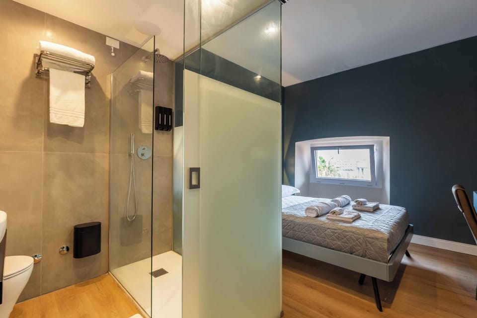Junior Double Room, City View | Bathroom | Shower, hair dryer, towels, soap