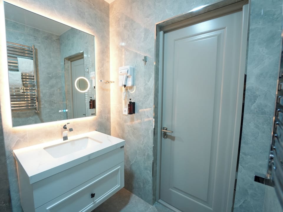 Shower, free toiletries, hair dryer, slippers