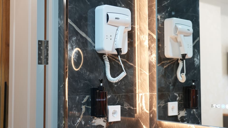 Shower, free toiletries, hair dryer, slippers