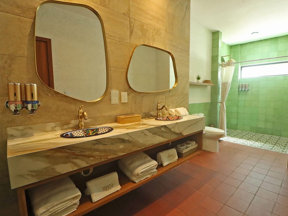 Family Suite, Garden View | Bathroom | Shower, hair dryer, bathrobes, bidet