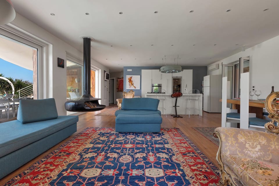 Villa | Living area | Flat-screen TV, fireplace