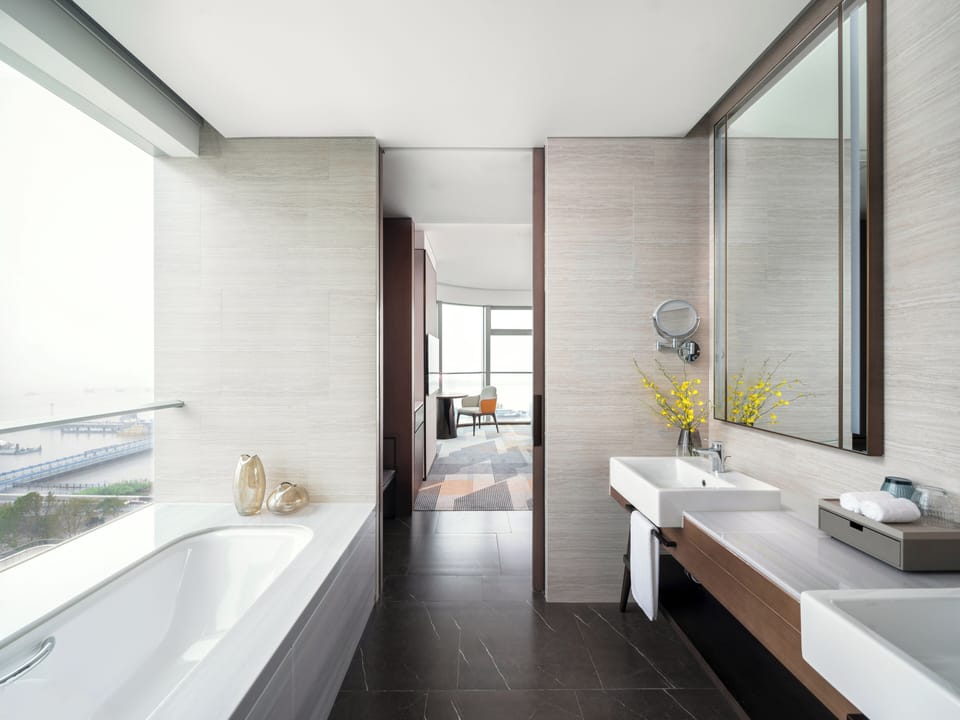 Junior Suite, 1 King Bed | Bathroom | Separate tub and shower, rainfall showerhead, free toiletries
