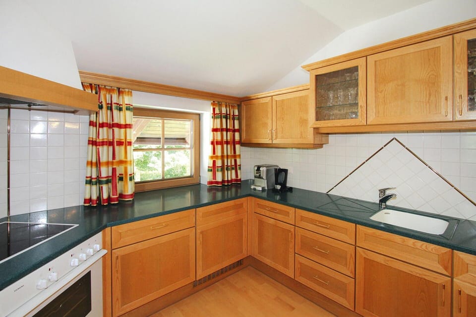 Apartment | Private kitchen | Stovetop, electric kettle, highchair