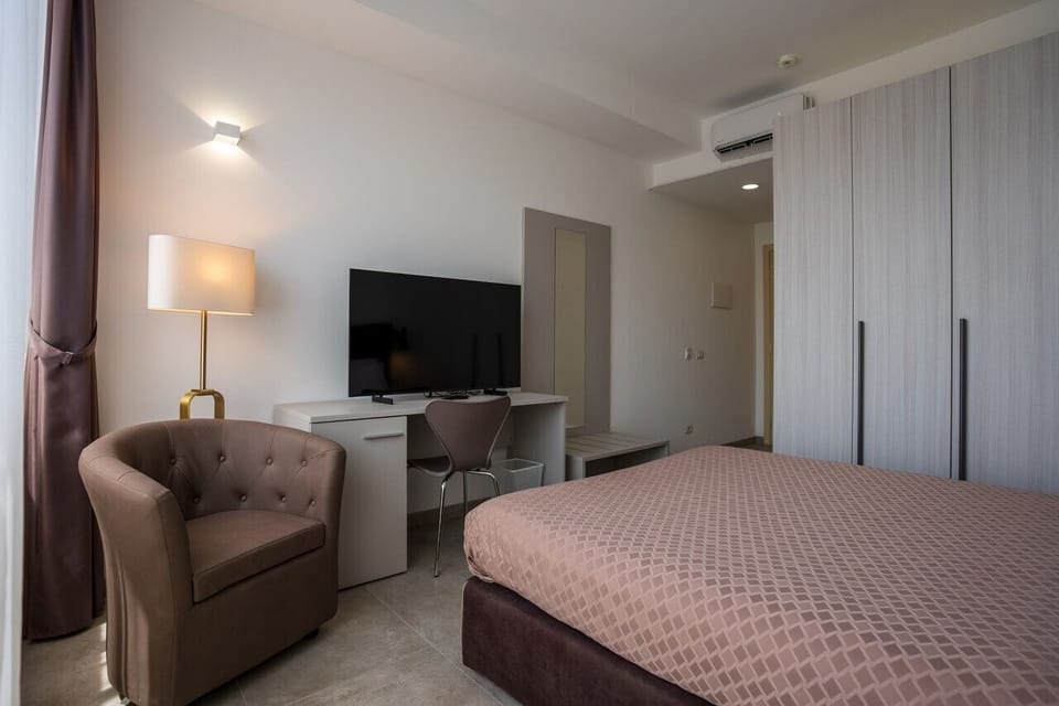 In-room safe, desk, blackout drapes, iron/ironing board