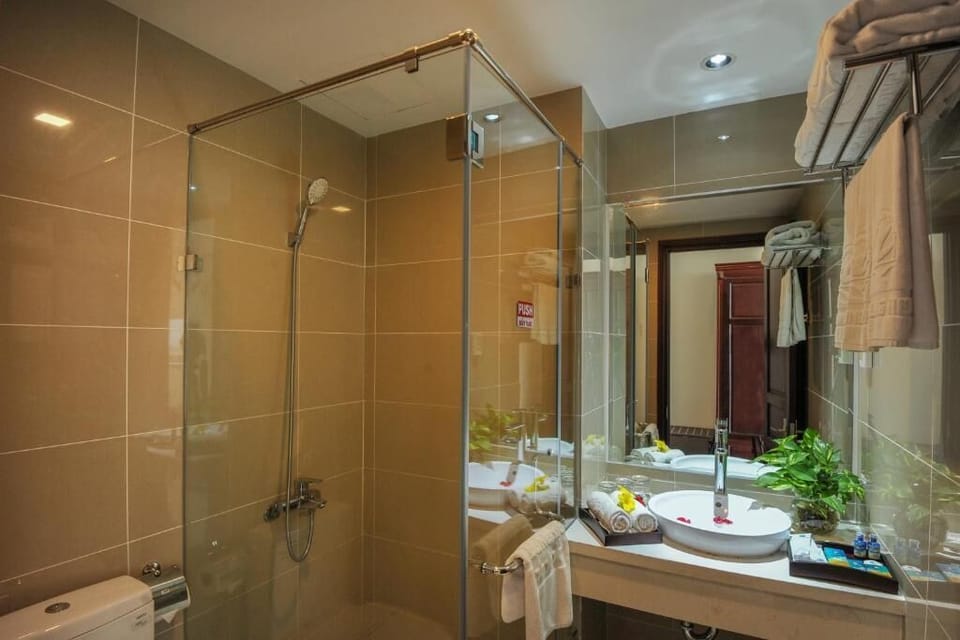 Shower, hair dryer, slippers, towels