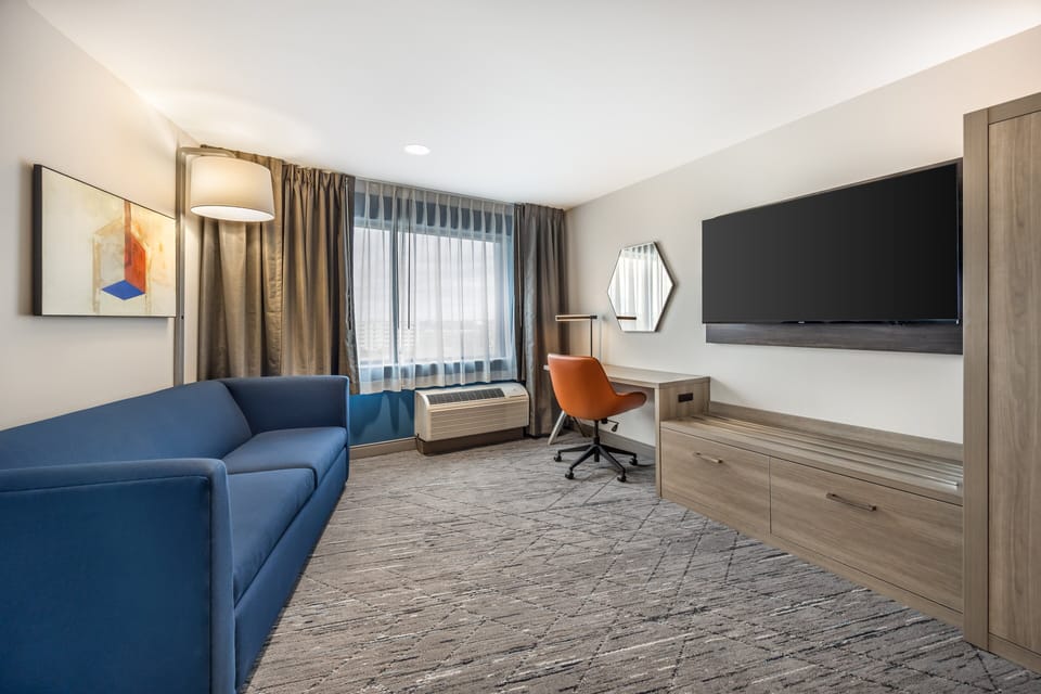 Suite, 1 Bedroom | In-room safe, laptop workspace, blackout drapes, soundproofing