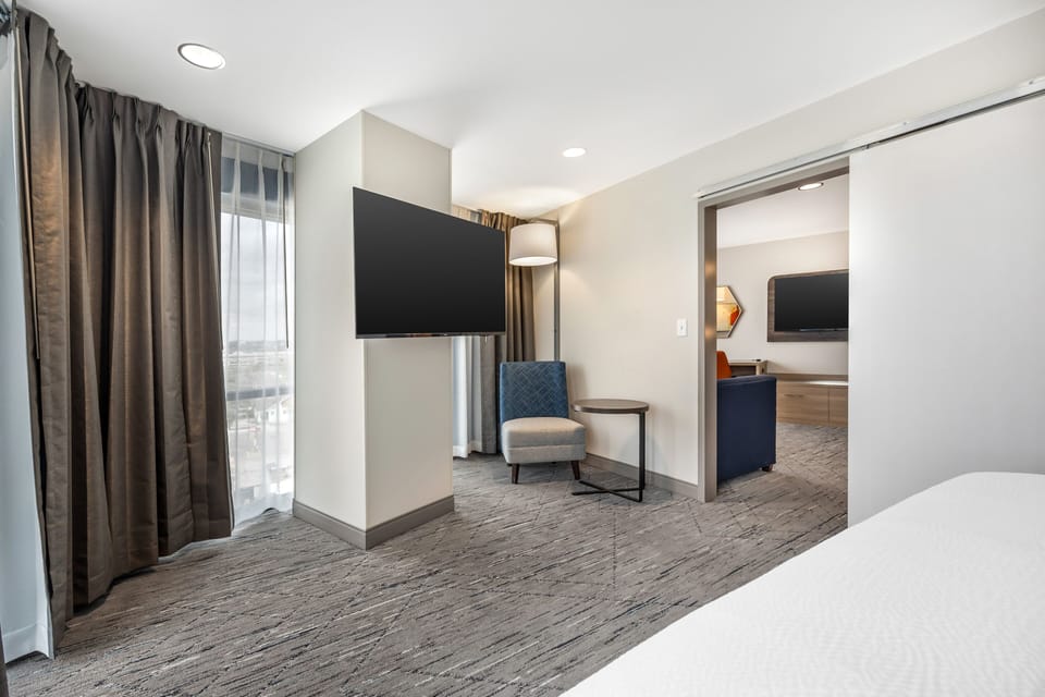 Suite, 1 Bedroom | In-room safe, laptop workspace, blackout drapes, soundproofing