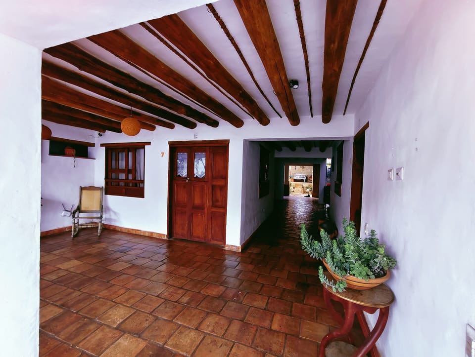 Classic Double Room, Balcony, Pool View | Living area