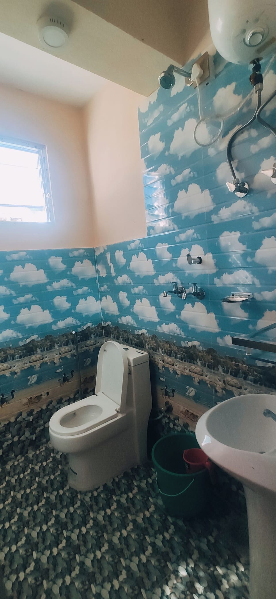 Shower, rainfall showerhead, slippers, towels