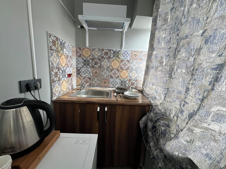 Family Suite, City View | Private kitchenette | Fridge, microwave, stovetop, electric kettle