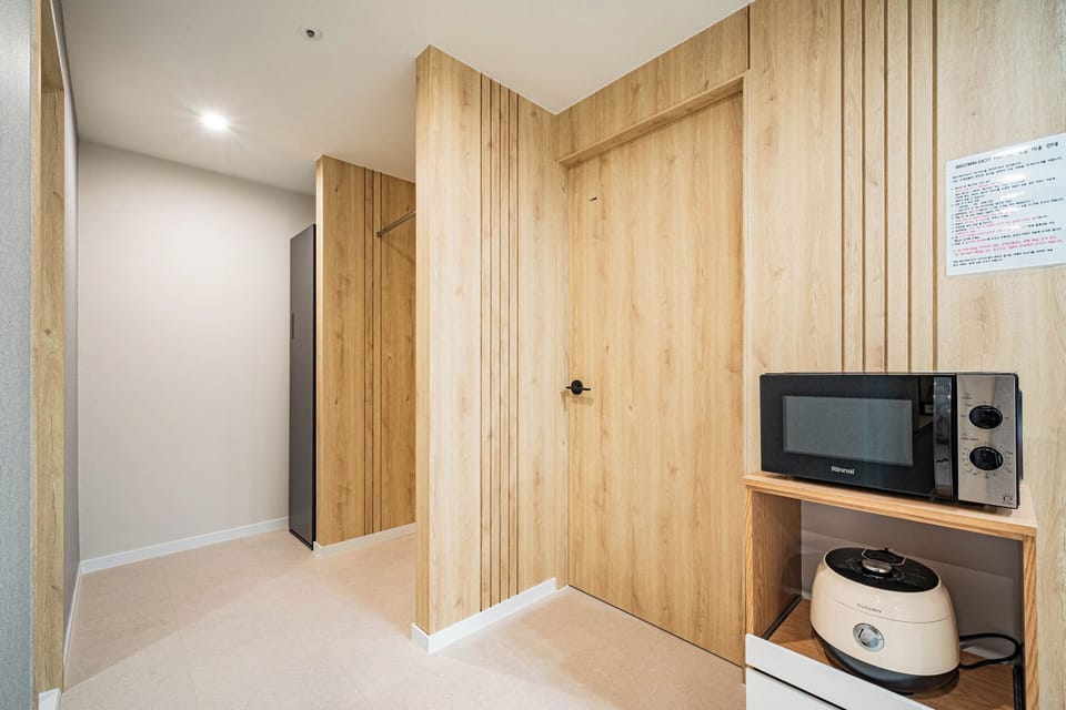 Premium Suite, City View | Private kitchen | Shared fridge, microwave, coffee/tea maker, electric kettle
